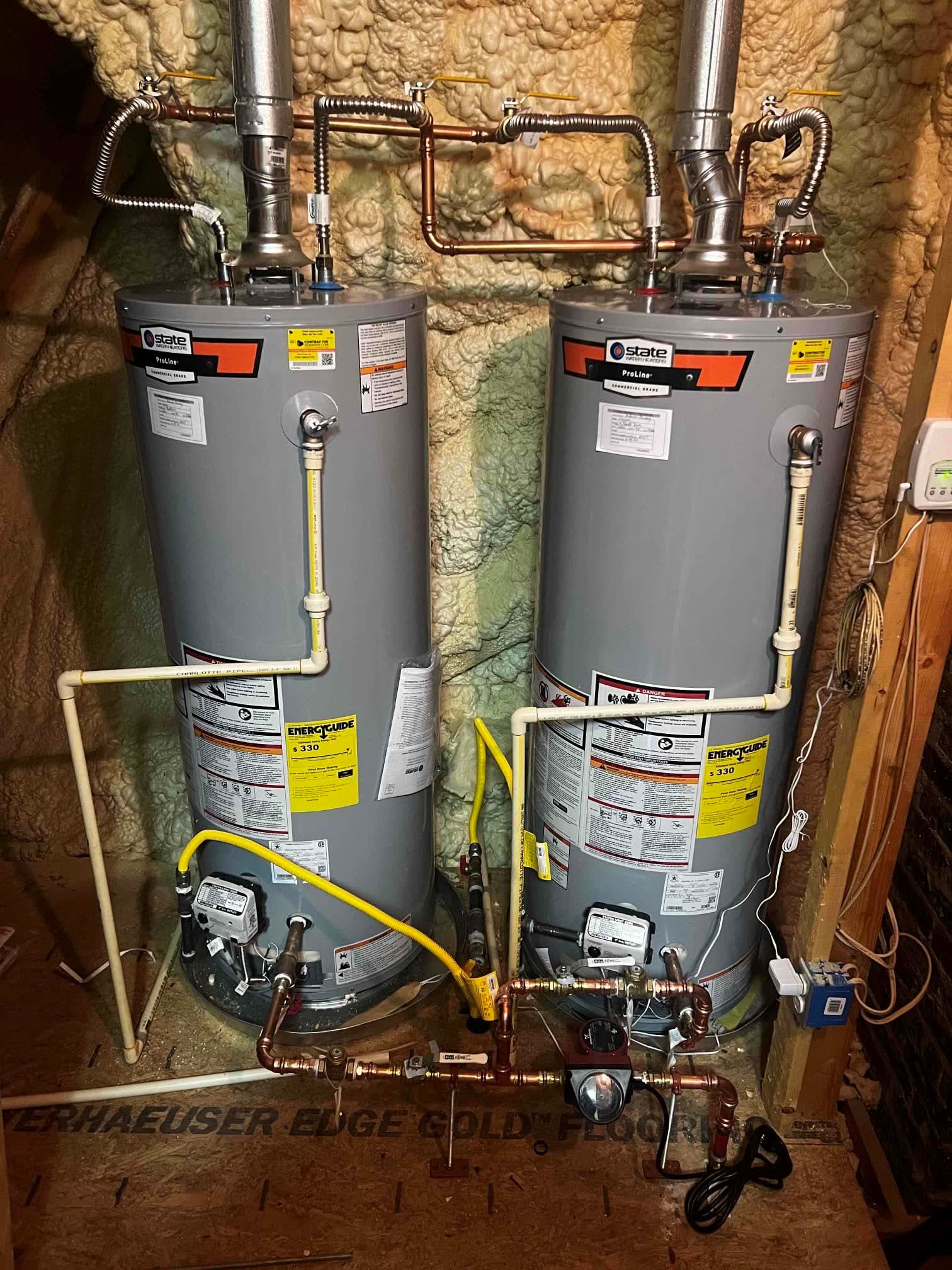 Two tank water heaters installed with copper supply lines
