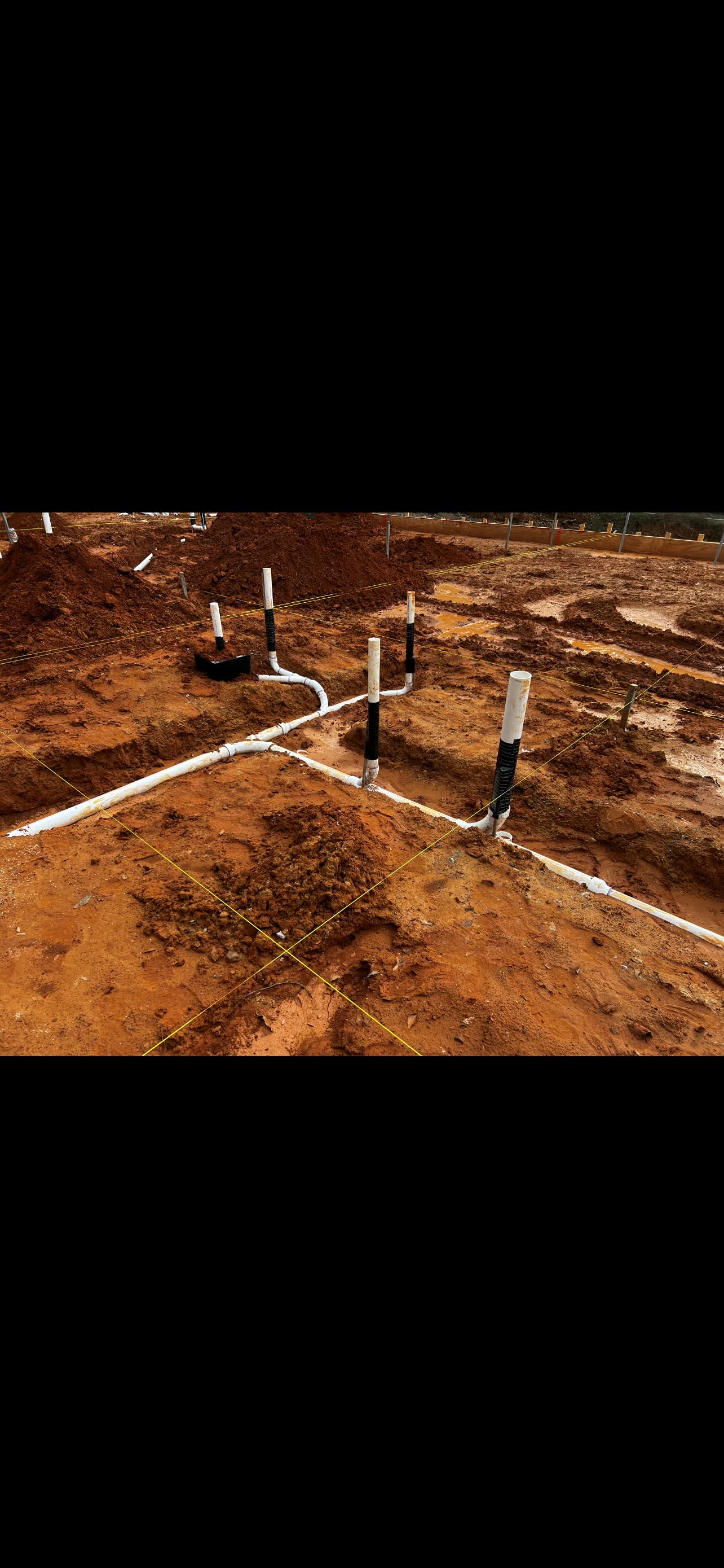 Underground drain rough-in set before a slab pour