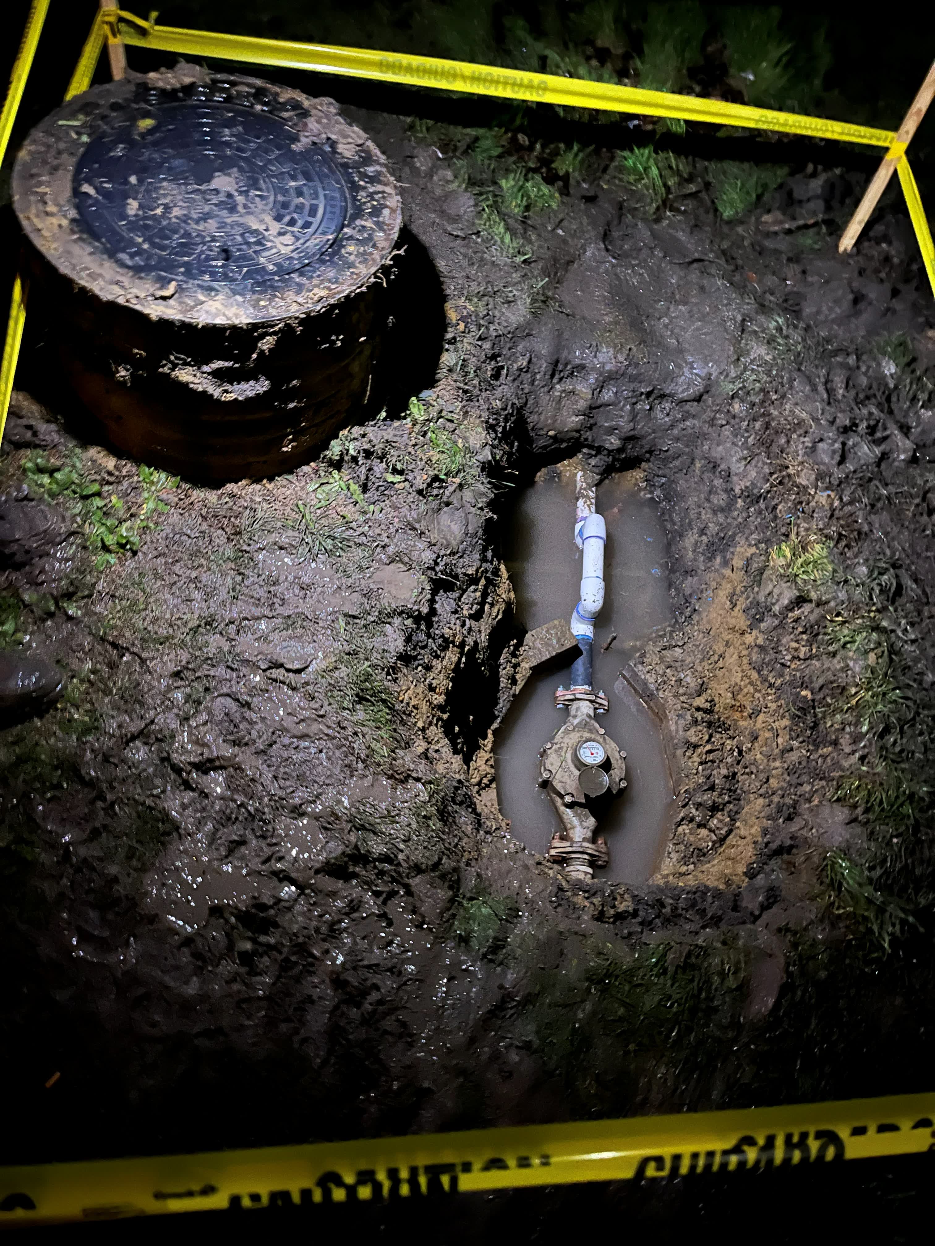 Night-time emergency repair at an open water meter box