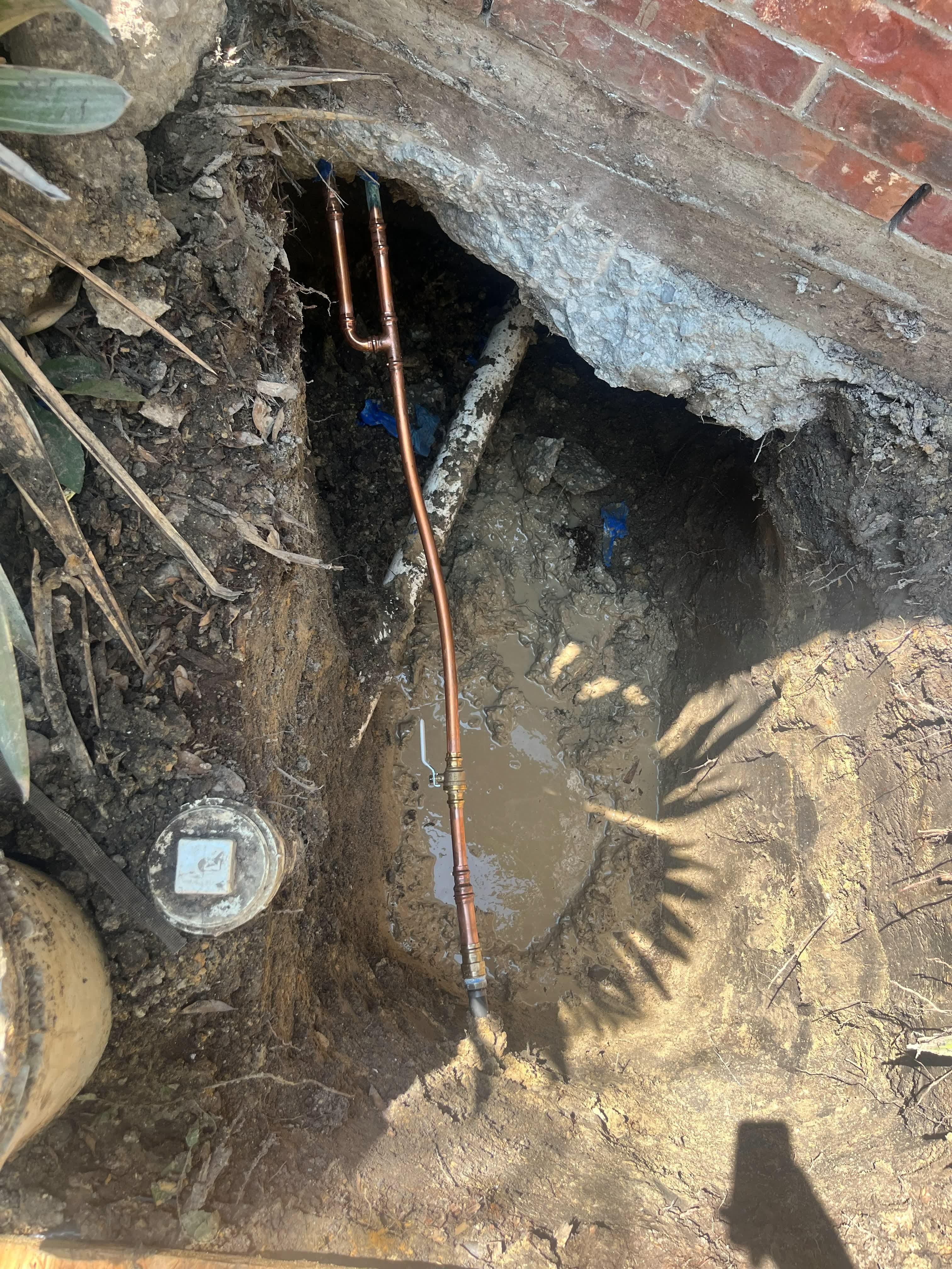 Copper line repair carried out beneath a house foundation